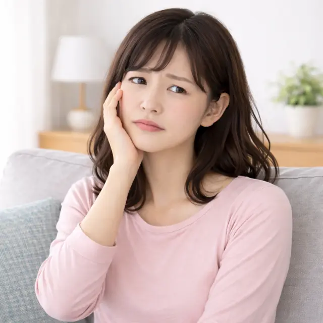 めまいや不調を感じている女性