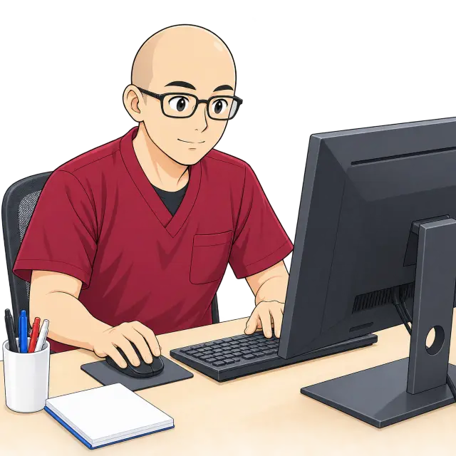 パソコンで作業する院長